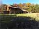 Charming Cabin Overlooking Pond with Premium Hunting Land Photo 2
